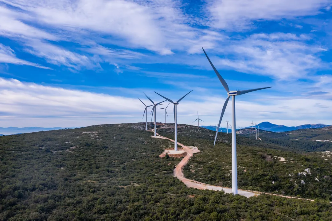 Image showing  wind-farm-wind-turbines-and-curvy-road-on-the-hill-green-ecological-power-energy-generation-1912458160