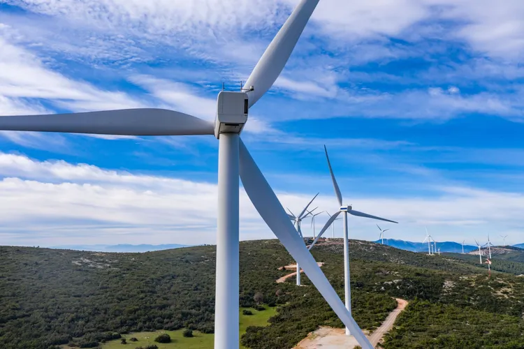 wind-farm-wind-turbines-and-curvy-road-on-the-hill-green-ecological-power-energy-generation-1912458199