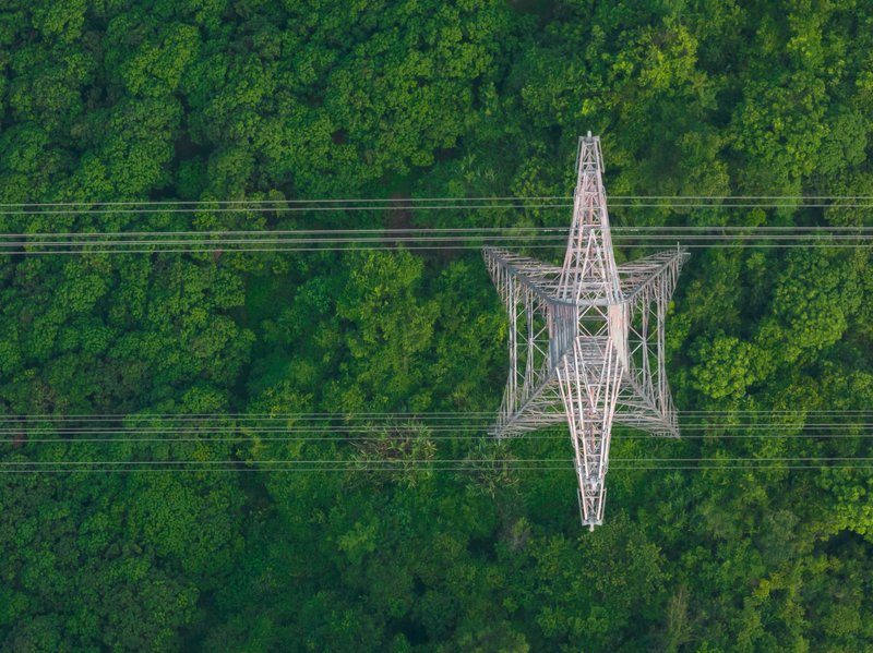 aerial-view-of-electricity-tower-on-mountain-2254892143