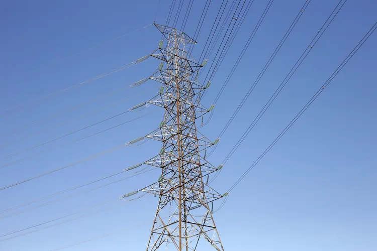 high-voltage-cables-and-transmission-towers-2475547741